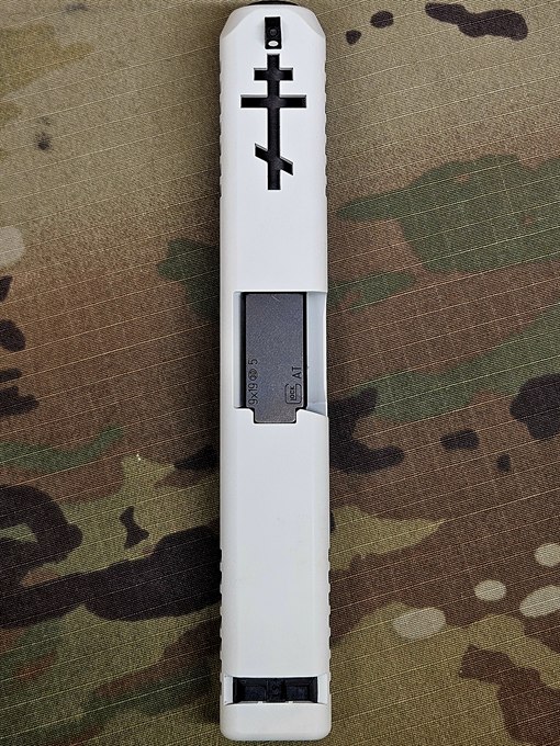 Slide in white Cerakote with a custom cross window cut