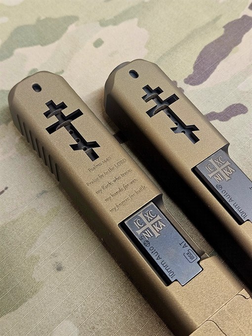 Close view of engraved scripture and cross windowing